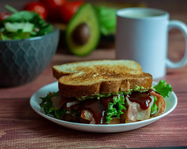 A classic BLT sandwich, featuring a dark, rich red sauce and
						toasted bread. The bacon is not crispy so as to balance the crunch of the bread.